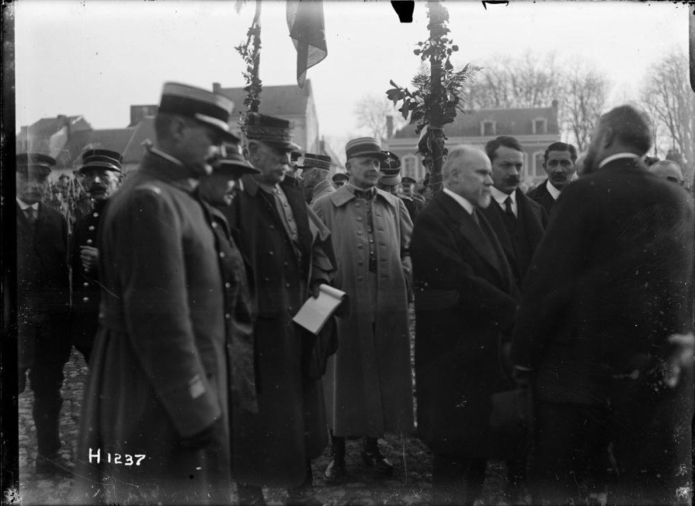 French President Raymond Poincaré of France (right of centre) after his arrival at Le Quesnoy. 10 November 1918.